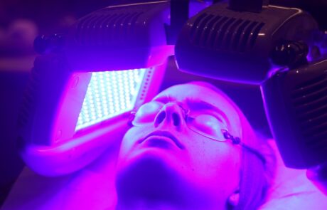 Client enjoying a Dermalux Tri-Wave MD LED Phototherapy treatment at SKIN lounge Aesthetics Richmond, using advanced LED light energy to boost collagen, reduce inflammation, and promote radiant skin.