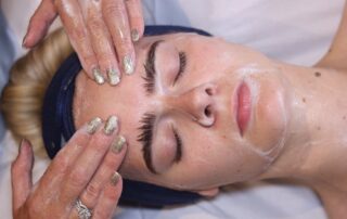 Client enjoying a HydraRefresh facial at SKIN lounge Aesthetics Richmond Hill, a cutting-edge treatment combining deep cleansing, exfoliation, and hydration technology to rejuvenate the skin, boost collagen, and enhance natural radiance.